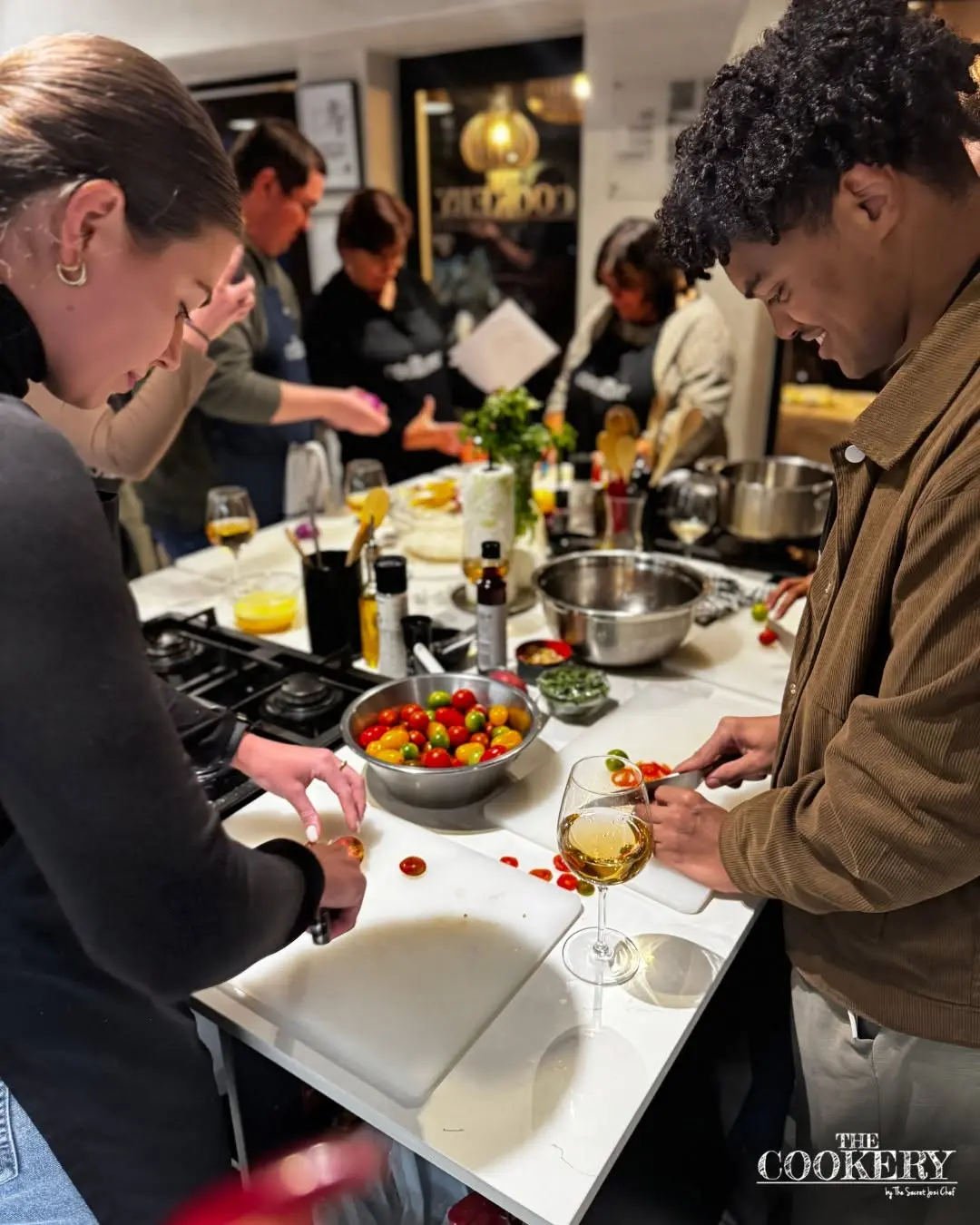 Guests cooking together at a private event at The Cookery